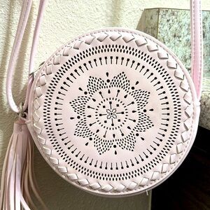 Baby pink Native American style round cross body purse.